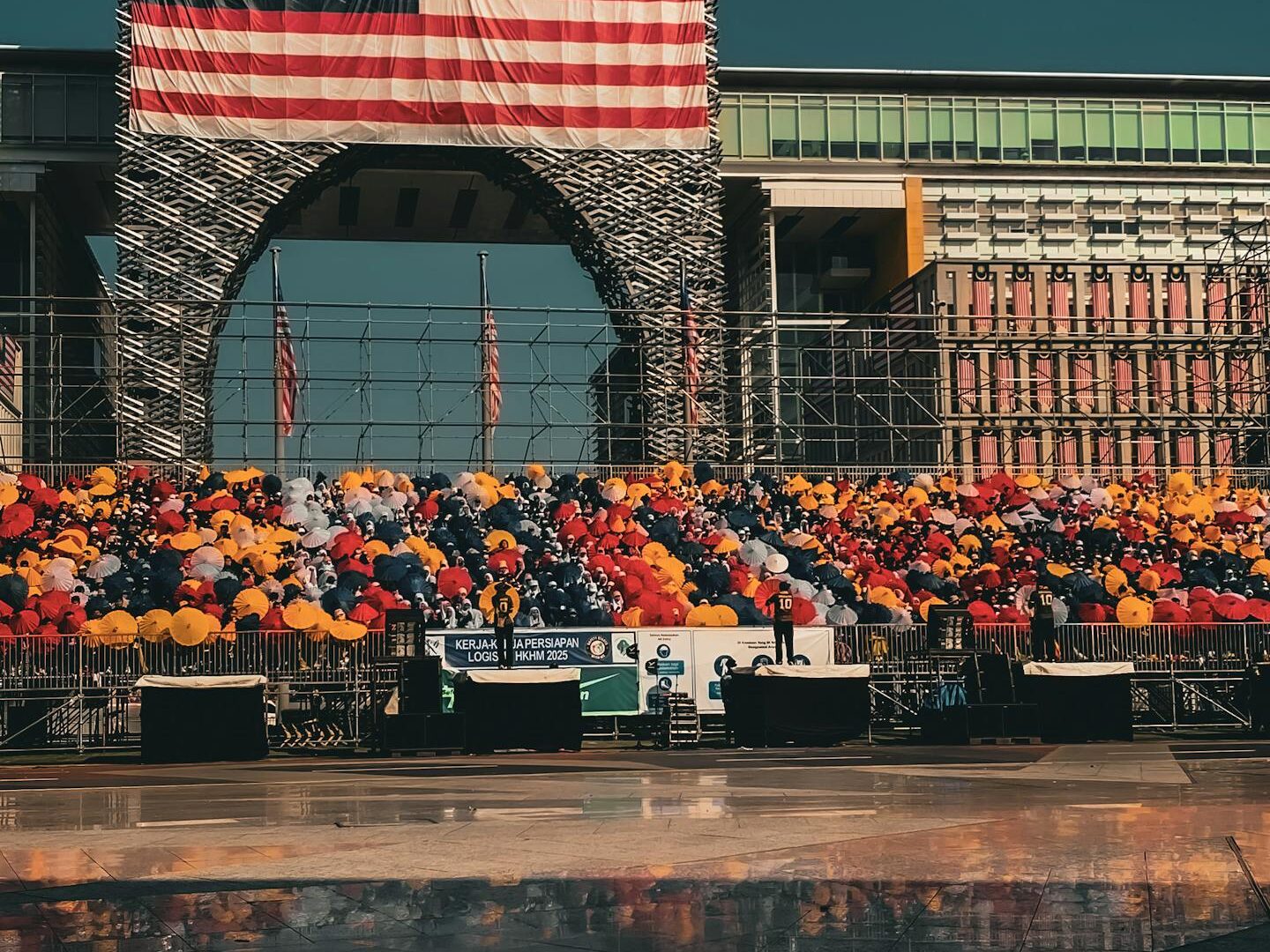 Colorful balloon setup and Malaysian flag in Putrajaya showcasing national pride.